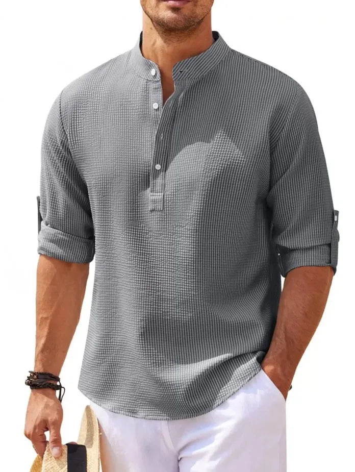 imagem da Camiseta Masculina de Linho Valor da Oron Store em fundo branco. Modelo disponível nas cores bege, branco, preto, azul, cinza e cinza escuro. Camiseta casual com tecido leve e respirável de linho e algodão, ideal para o verão 2025. Roupa masculina versátil, com caimento moderno e design elegante. Disponível nos tamanhos PP ao G3.