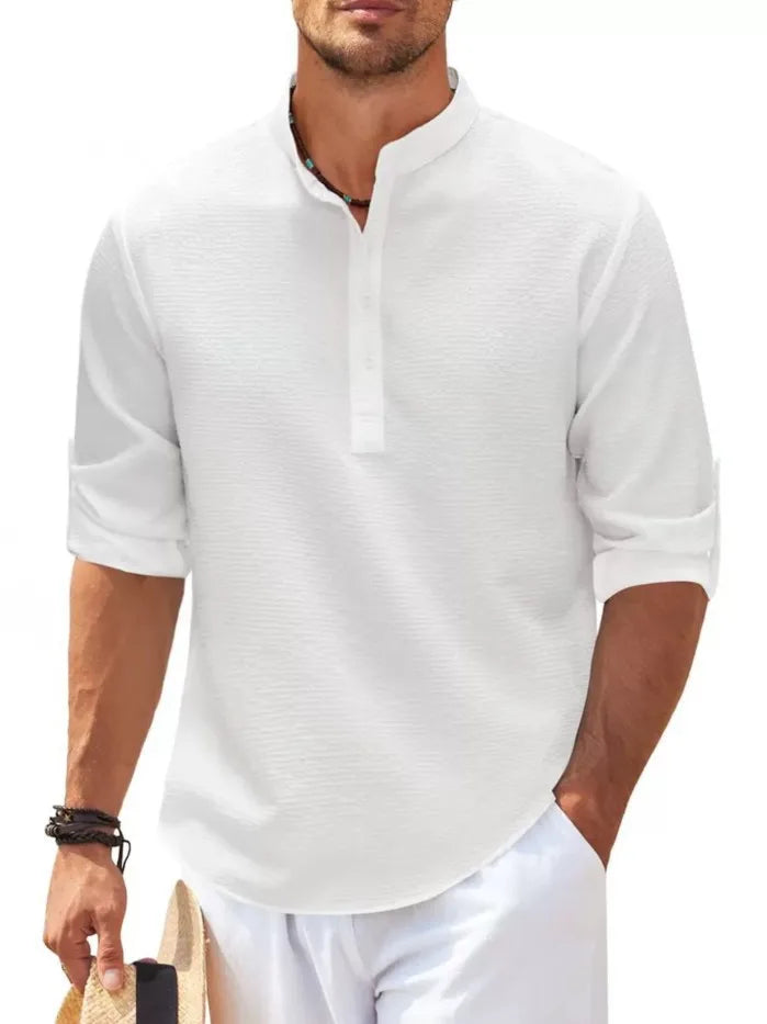 imagem da Camiseta Masculina de Linho Valor da Oron Store em fundo branco. Modelo disponível nas cores bege, branco, preto, azul, cinza e cinza escuro. Camiseta casual com tecido leve e respirável de linho e algodão, ideal para o verão 2025. Roupa masculina versátil, com caimento moderno e design elegante. Disponível nos tamanhos PP ao G3.